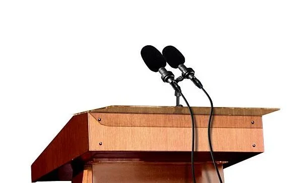 Microphones on the podium over white