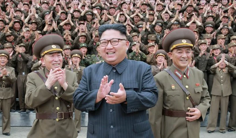 North Korean leader Kim Jong Un claps with military officers at the Command of the Strategic Force of the Korean People’s Army (KPA) in an unknown location in North Korea